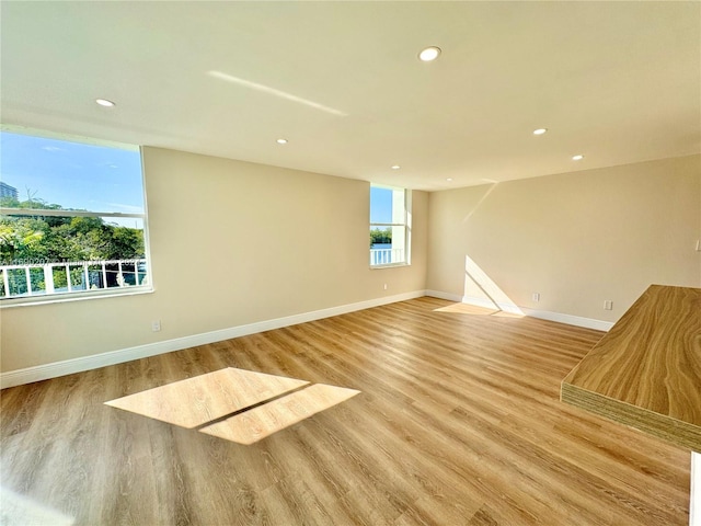 spare room with light wood-type flooring