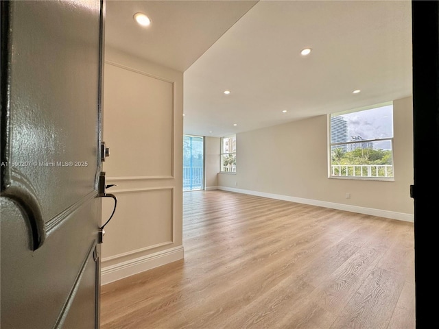16546 NE 26th Ave Unit 3G, North Miami Beach, FL 33160 - unfurnished room featuring light wood-style floors and recessed lighting