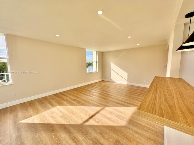 unfurnished room featuring hardwood / wood-style flooring