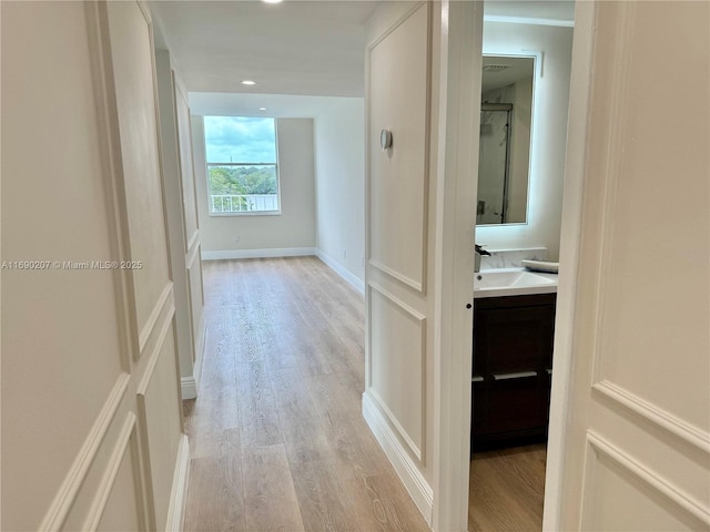 16546 NE 26th Ave Unit 3G, North Miami Beach, FL 33160 - corridor featuring light wood-type flooring and recessed lighting