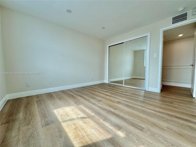 16546 NE 26th Ave Unit 3G, North Miami Beach, FL 33160 - unfurnished bedroom with light wood-style floors and a closet