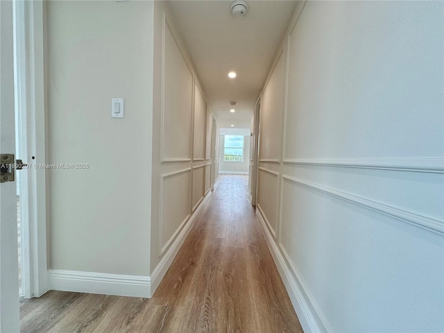 16546 NE 26th Ave Unit 3G, North Miami Beach, FL 33160 - hallway featuring wood finished floors and recessed lighting