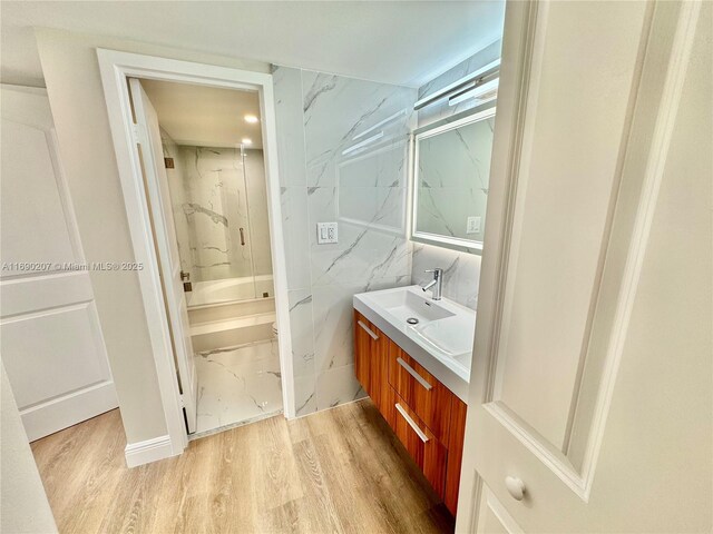 16546 NE 26th Ave Unit 3G, North Miami Beach, FL 33160 - bathroom with vanity, shower / bath combination, marble finish floors, and recessed lighting
