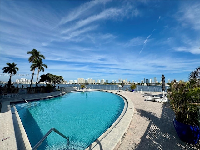 16546 NE 26th Ave Unit 3G, North Miami Beach, FL 33160 - community pool with a skyline view and a patio