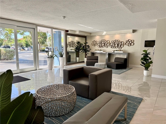 16546 NE 26th Ave Unit 3G, North Miami Beach, FL 33160 - lobby with a textured ceiling and floor to ceiling windows