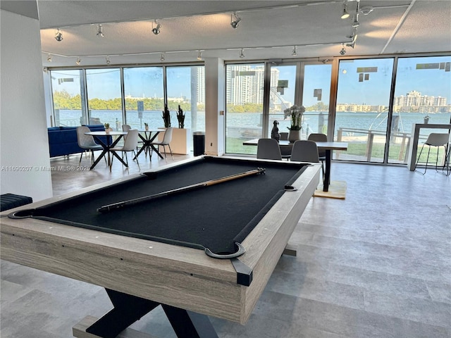 16546 NE 26th Ave Unit 3G, North Miami Beach, FL 33160 - game room with pool table, track lighting, and a water view