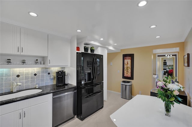 kitchen featuring dishwasher, sink, black fridge with ice dispenser, light tile patterned flooring, and white cabinetry