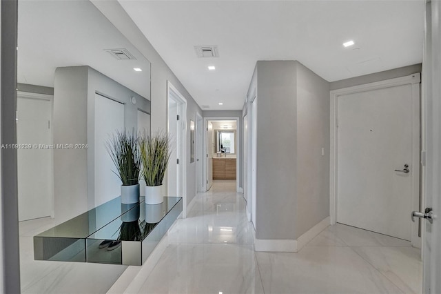 16385 NE Biscayne Blvd Unit 307 2Parking, North Miami Beach, FL 33160 - hallway with baseboards and marble finish flooring