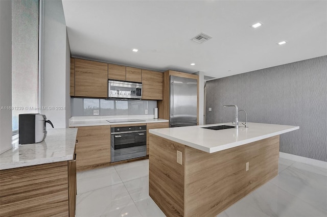 16385 NE Biscayne Blvd Unit 307 2Parking, North Miami Beach, FL 33160 - kitchen with black appliances, a sink, modern cabinets, light marble finish flooring, and light countertops