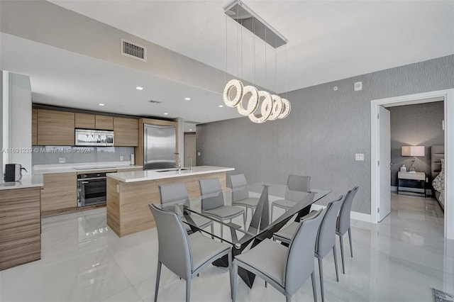 dining space featuring sink