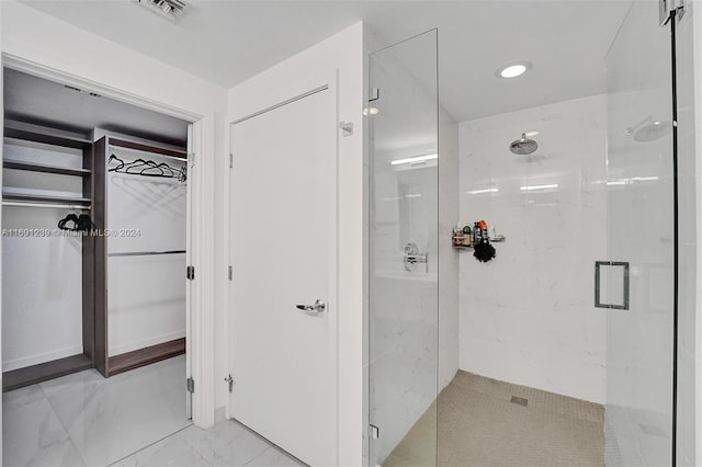 16385 NE Biscayne Blvd Unit 307 2Parking, North Miami Beach, FL 33160 - bathroom with a shower stall, a spacious closet, marble look tiles, and recessed lighting