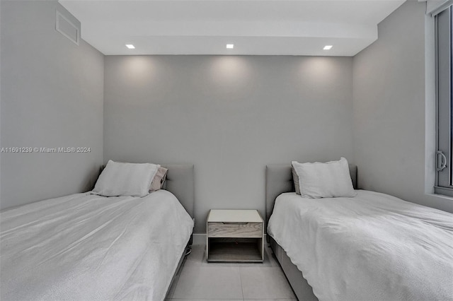 bedroom featuring light tile patterned floors