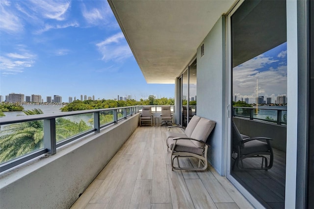 balcony featuring a water view