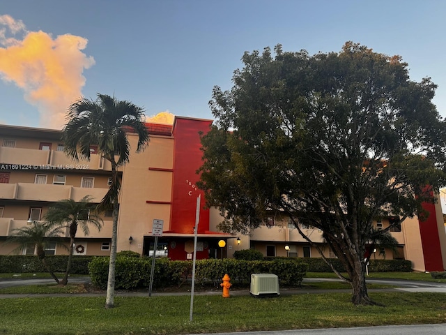 outdoor building at dusk featuring central AC