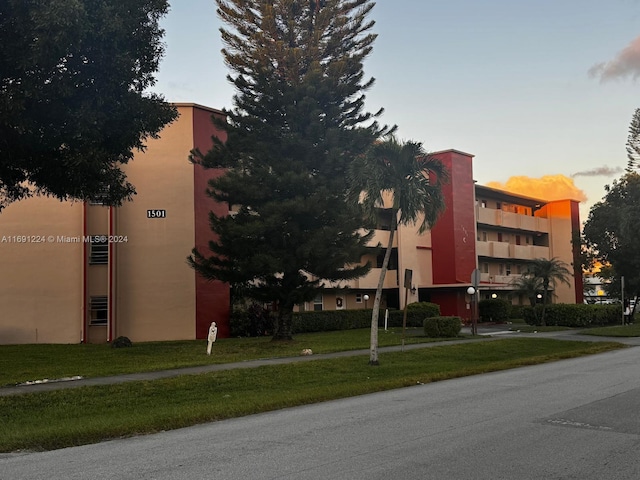 view of outdoor building at dusk