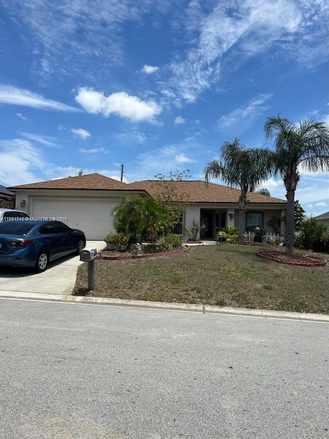 ranch-style home with a front lawn and a garage