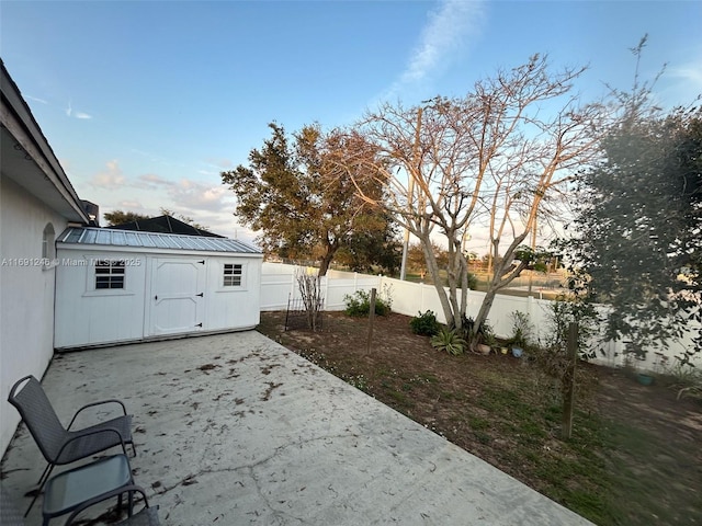 view of patio / terrace featuring a storage unit