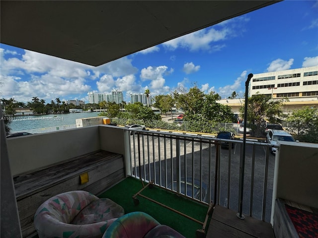 balcony featuring a water view