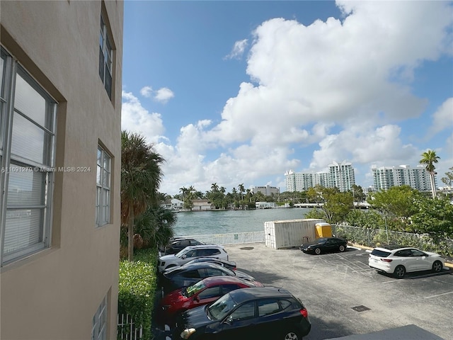 view of parking with a water view