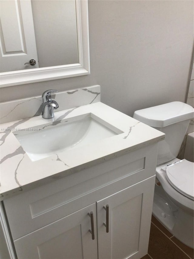 bathroom with vanity and toilet