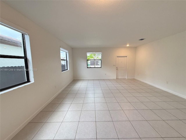 spare room with recessed lighting, baseboards, visible vents, and light tile patterned floors