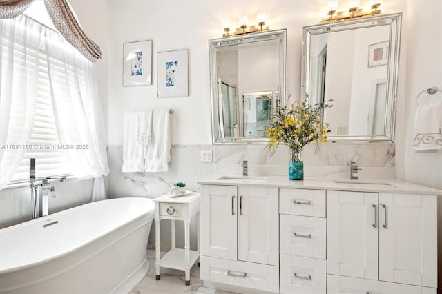 bathroom featuring vanity and a bathtub