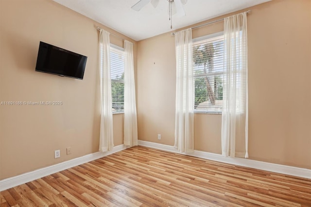 unfurnished room with ceiling fan and light hardwood / wood-style floors