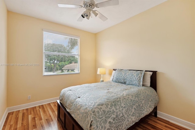 bedroom featuring hardwood / wood-style floors and ceiling fan