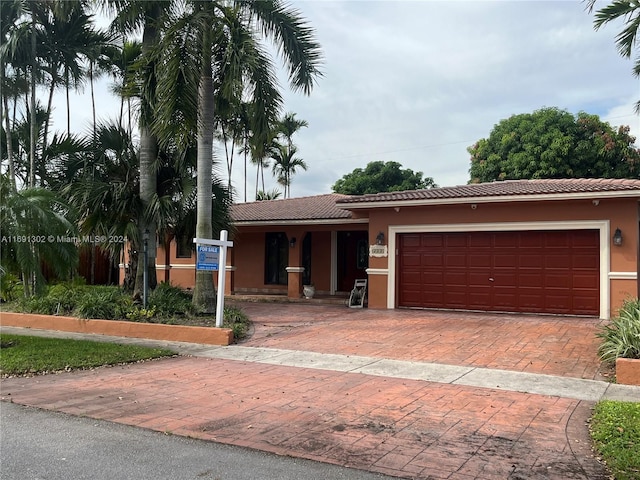 view of front of property with a garage