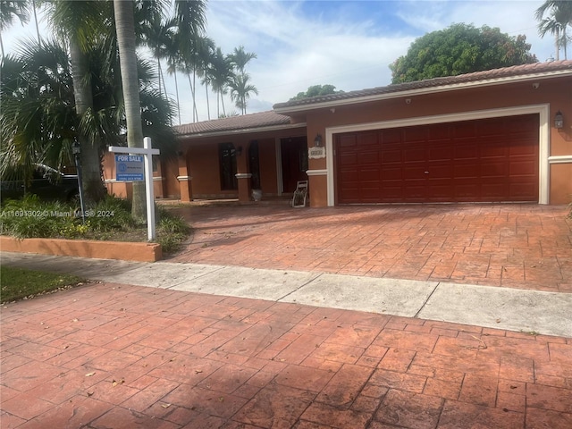 view of front of home with a garage