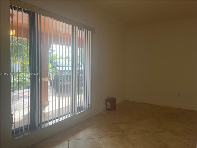 view of tiled spare room