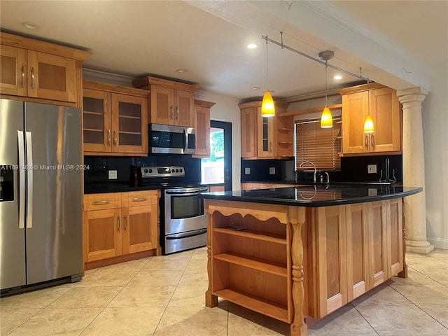 kitchen with backsplash, ornate columns, pendant lighting, and appliances with stainless steel finishes