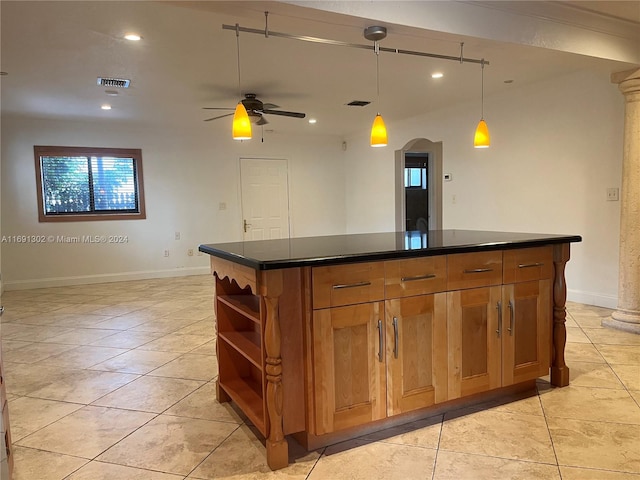 bar with decorative columns, pendant lighting, light tile patterned floors, and ceiling fan