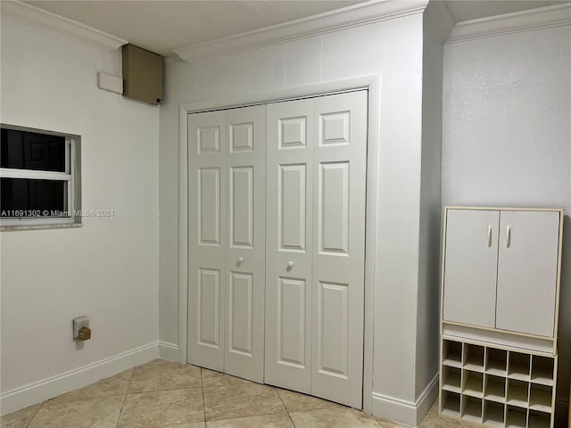 details with tile patterned floors and crown molding