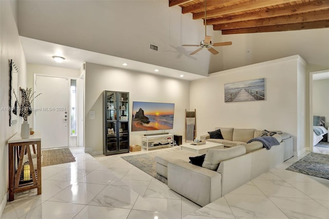 living room featuring ceiling fan, beam ceiling, and high vaulted ceiling