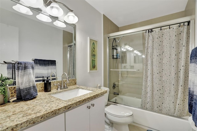 full bathroom featuring vanity, tiled shower / bath, and toilet