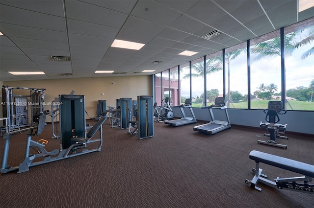 workout area featuring a drop ceiling