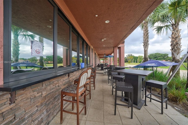 view of patio with exterior bar