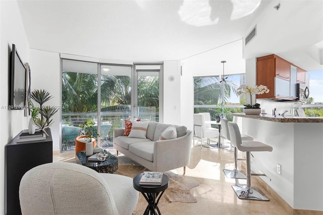 living room with a wall of windows