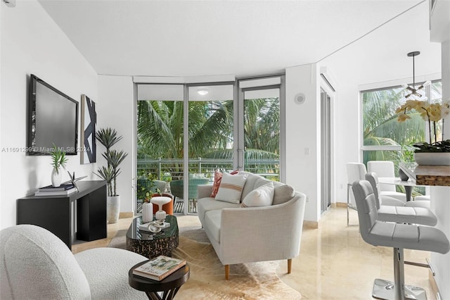 living room featuring expansive windows and plenty of natural light