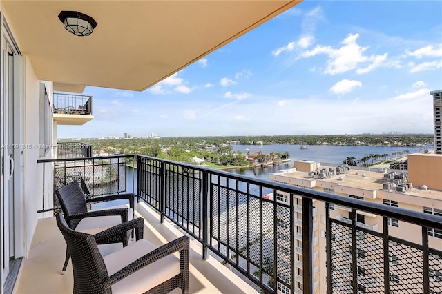 balcony featuring a water view