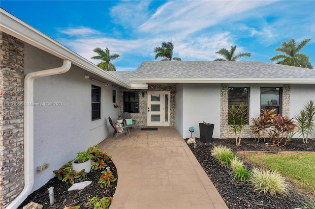 property entrance with a patio area