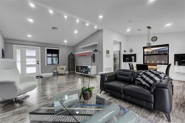 living room featuring hardwood / wood-style floors and lofted ceiling