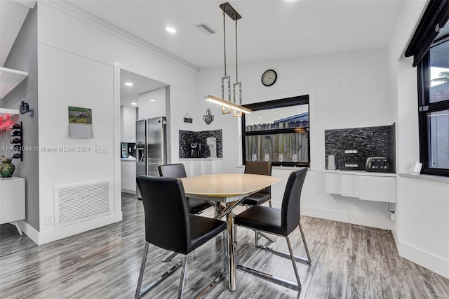 dining area with hardwood / wood-style flooring