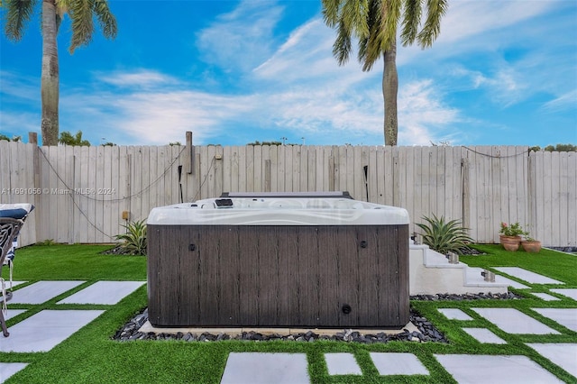 view of yard featuring a hot tub and central air condition unit