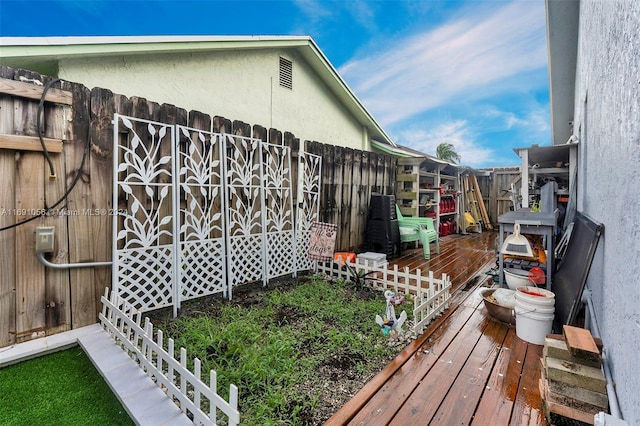 view of side of property featuring a wooden deck