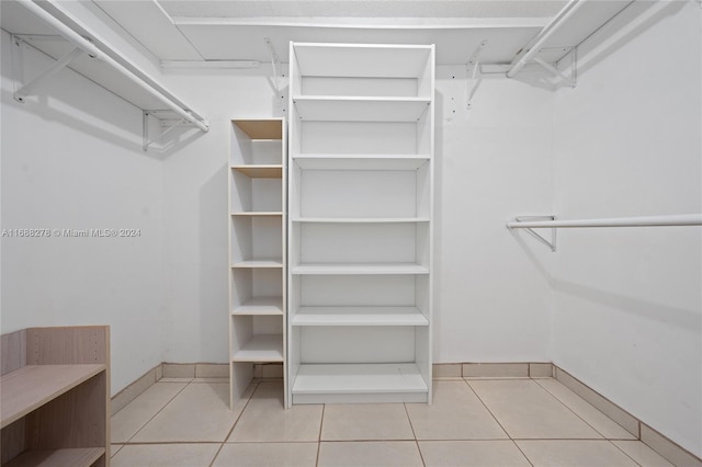 walk in closet featuring light tile patterned floors