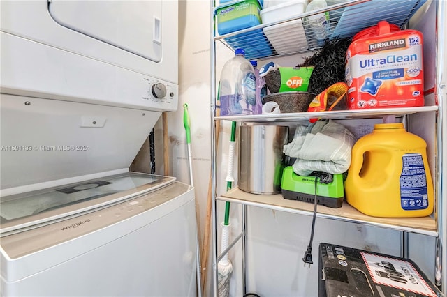 washroom with stacked washer and clothes dryer