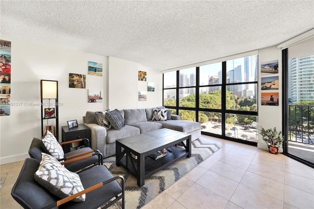 tiled living room with expansive windows, a textured ceiling, and plenty of natural light