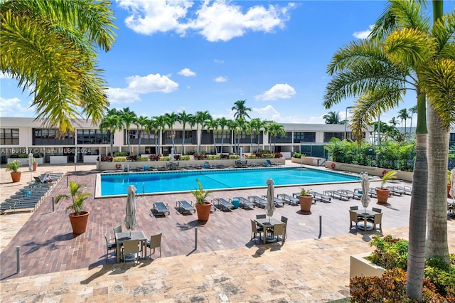 view of swimming pool featuring a patio area